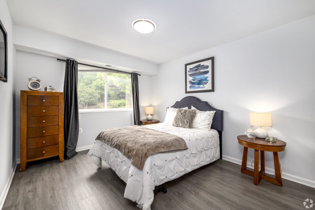 Bedroom With Bed, Curtains & Window